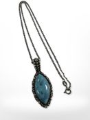 A Sterling silver necklace with silver and turquoise lozenge shape pendant, chain length 40 cm.