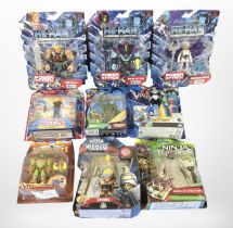 Nine Mattel and other figurines including He-Man, Gormiti, Teenage Mutant Ninja Turtles, etc.