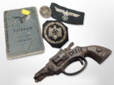 A German Third Reich Luftwaffe Soldbuch, together with a diecast metal German wound badge,