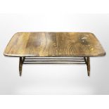 An Ercol stained elm low coffee table, 105cm wide x 46cm deep x 36cm high.