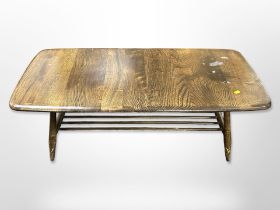 An Ercol stained elm low coffee table, 105cm wide x 46cm deep x 36cm high.