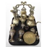 A group of Indian engraved and enamelled brass wares, hand bells,