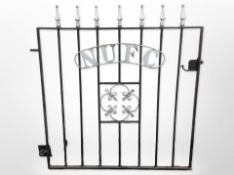 A cast iron NUFC garden gate,