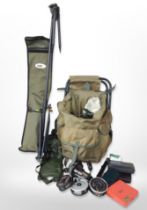 A group of fishing equipment including folding seat, reels, etc.