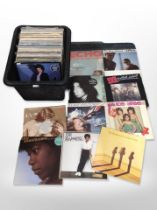 A collection of vinyl LP records including Billy Idol, Joan Armatrading, Sinéad O'Connor,