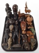 A group of African carved hardwood busts and other figures.