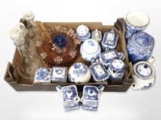 A group of Ringtons blue and white caddies, jugs and teapots, three glass decanters, paperweight,
