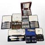 A cased set of six silver coffee spoons and eight further boxed cutlery sets