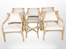 A set of five bamboo armchairs and matching glass-topped occasional table.