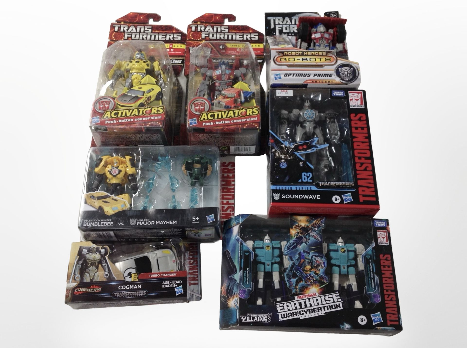 Seven Hasbro Transformers figures, boxed.