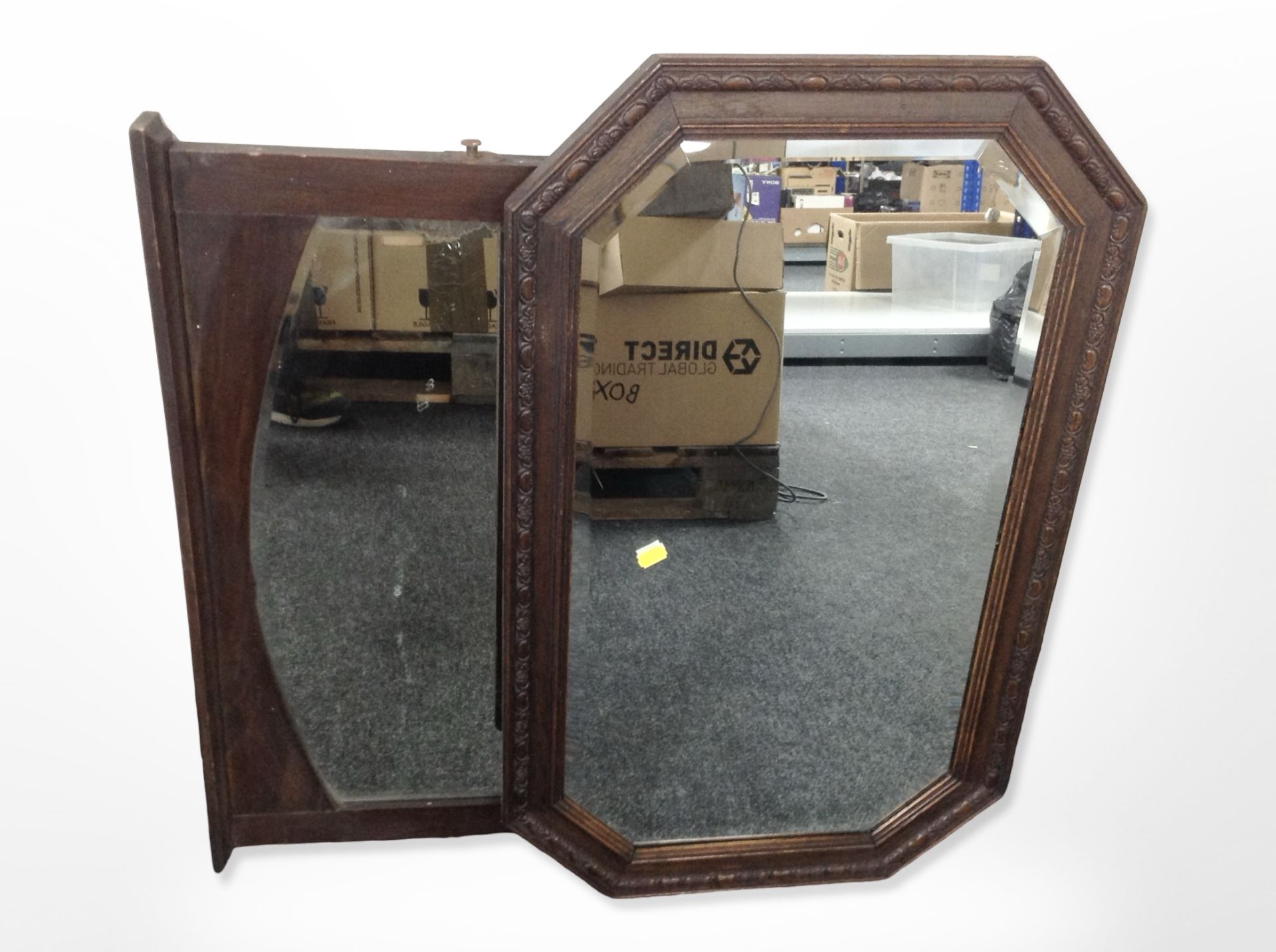 An Edwardian carved oak octagonal overmantle mirror, a further mirror,