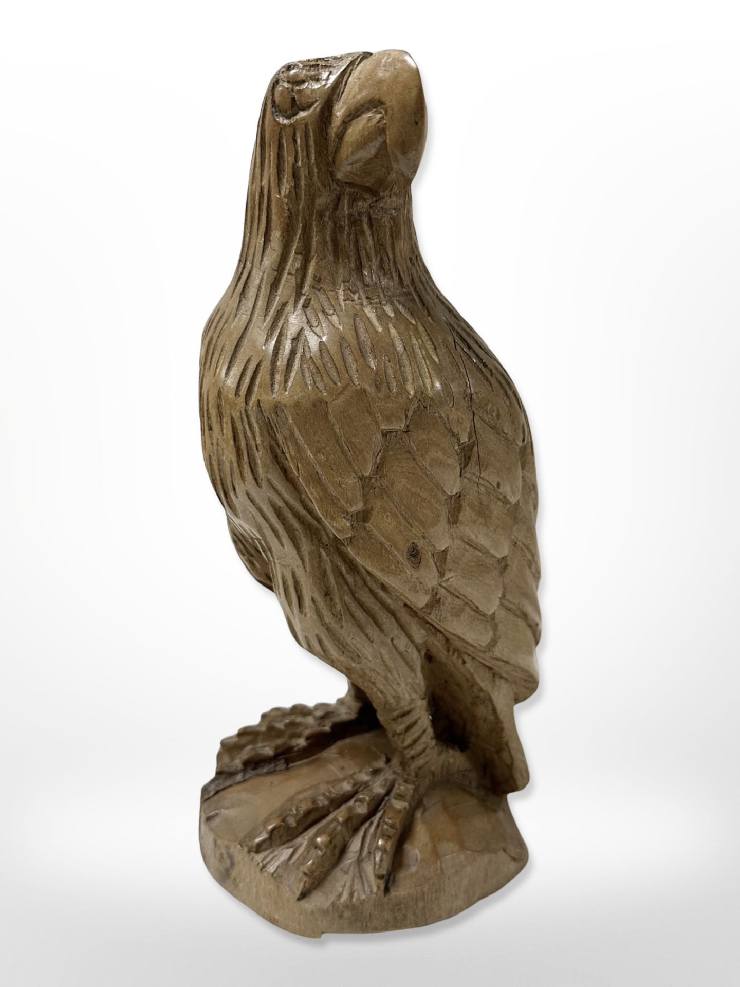 A carved wooden figure of an eagle, height 27 cm.