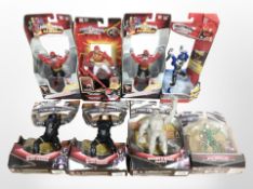 Eight Bandai Power Rangers figurines, boxed.