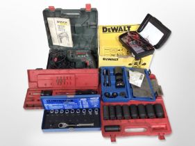 A group of boxed power tools and hardware including DeWalt DW613 plunge router, Bosch drill, etc.