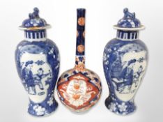 A pair of Chinese blue and white porcelain lidded vases, height 20cm.