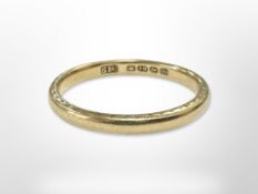 An 18ct gold band ring, size P CONDITION REPORT: 2.