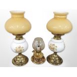 A pair of table lamps in the form of oil lamps,