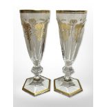 A pair of 19th century Baccarat gilt and faceted crystal wine glasses, height 18cm.