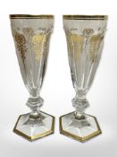A pair of 19th century Baccarat gilt and faceted crystal wine glasses, height 18cm.