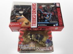 Three Hasbro Transformers figurines, boxed.
