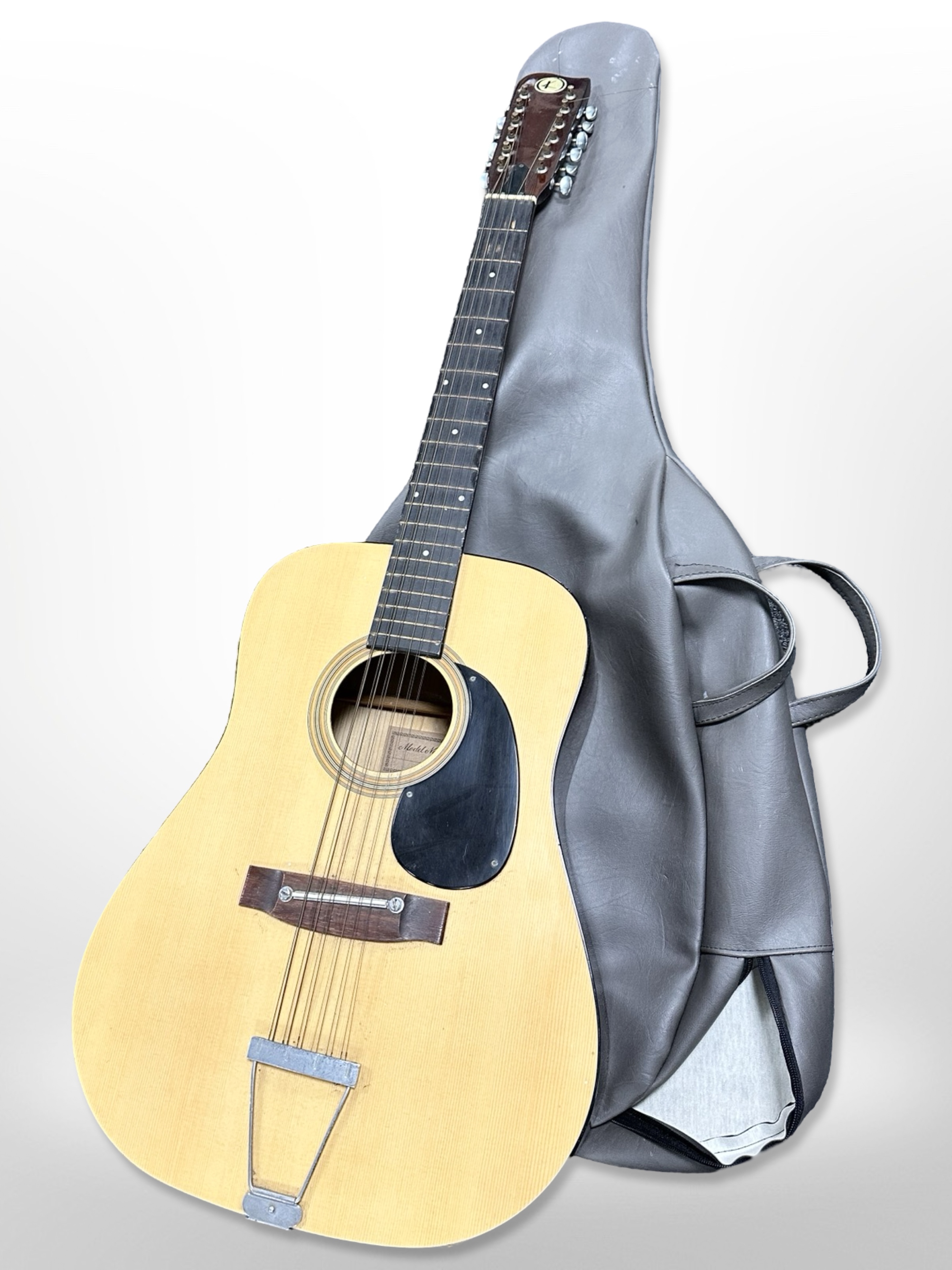 A vintage circa 1970 Kay 12-string acoustic guitar in soft carry bag.
