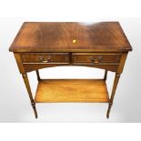 A reproduction mahogany two drawer side table,