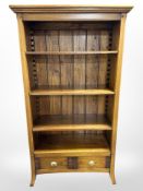 A contemporary hardwood open bookcase,