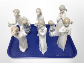 Six Lladró/Nao figures of children in night dress.