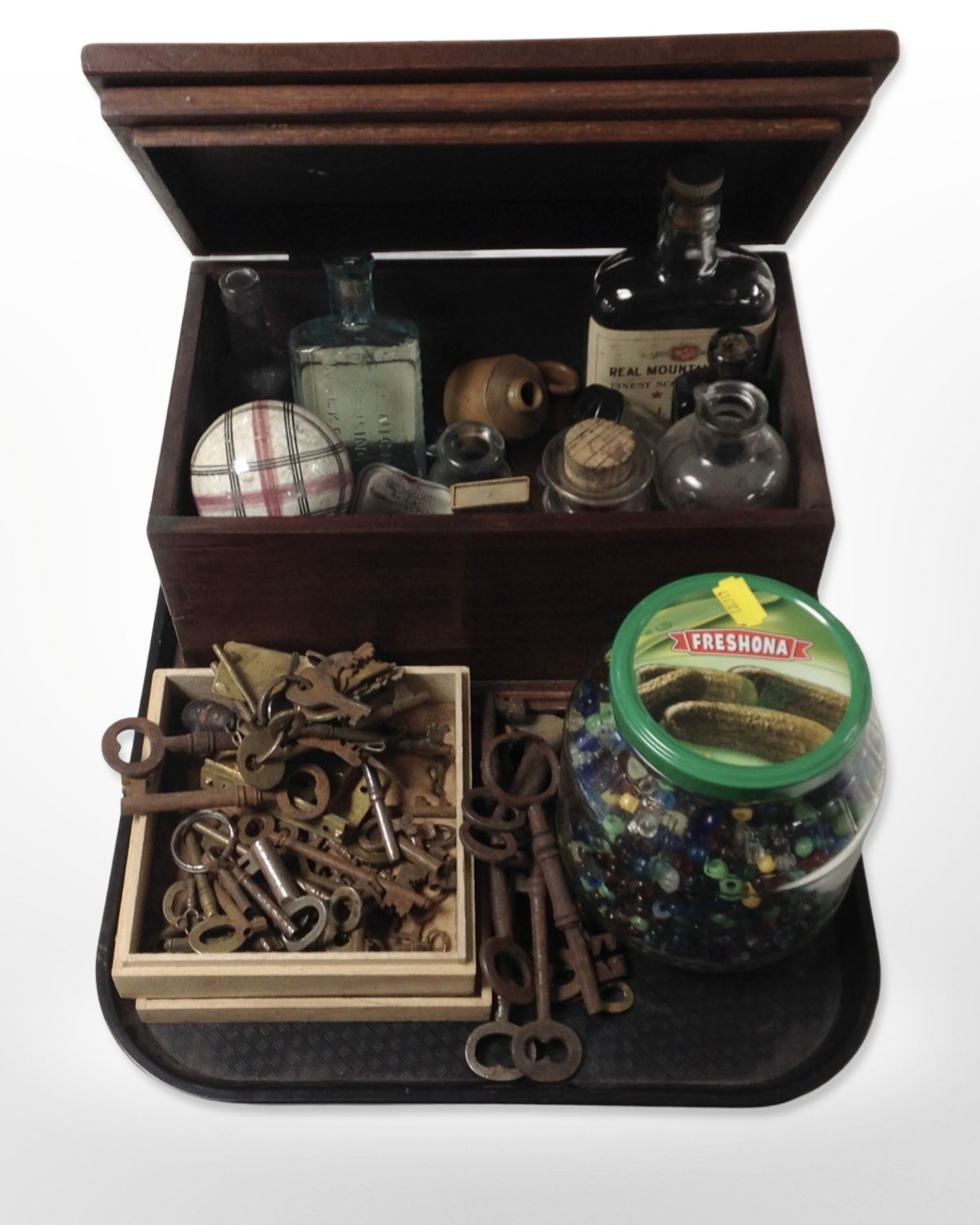 A collection of antique keys, jar containing a large quantity of glass beads,