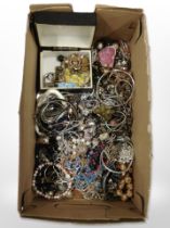 A box of mixed costume jewellery, bangles, bracelets, necklaces, etc.