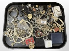 A group of costume jewellery, wristwatches, brooches,