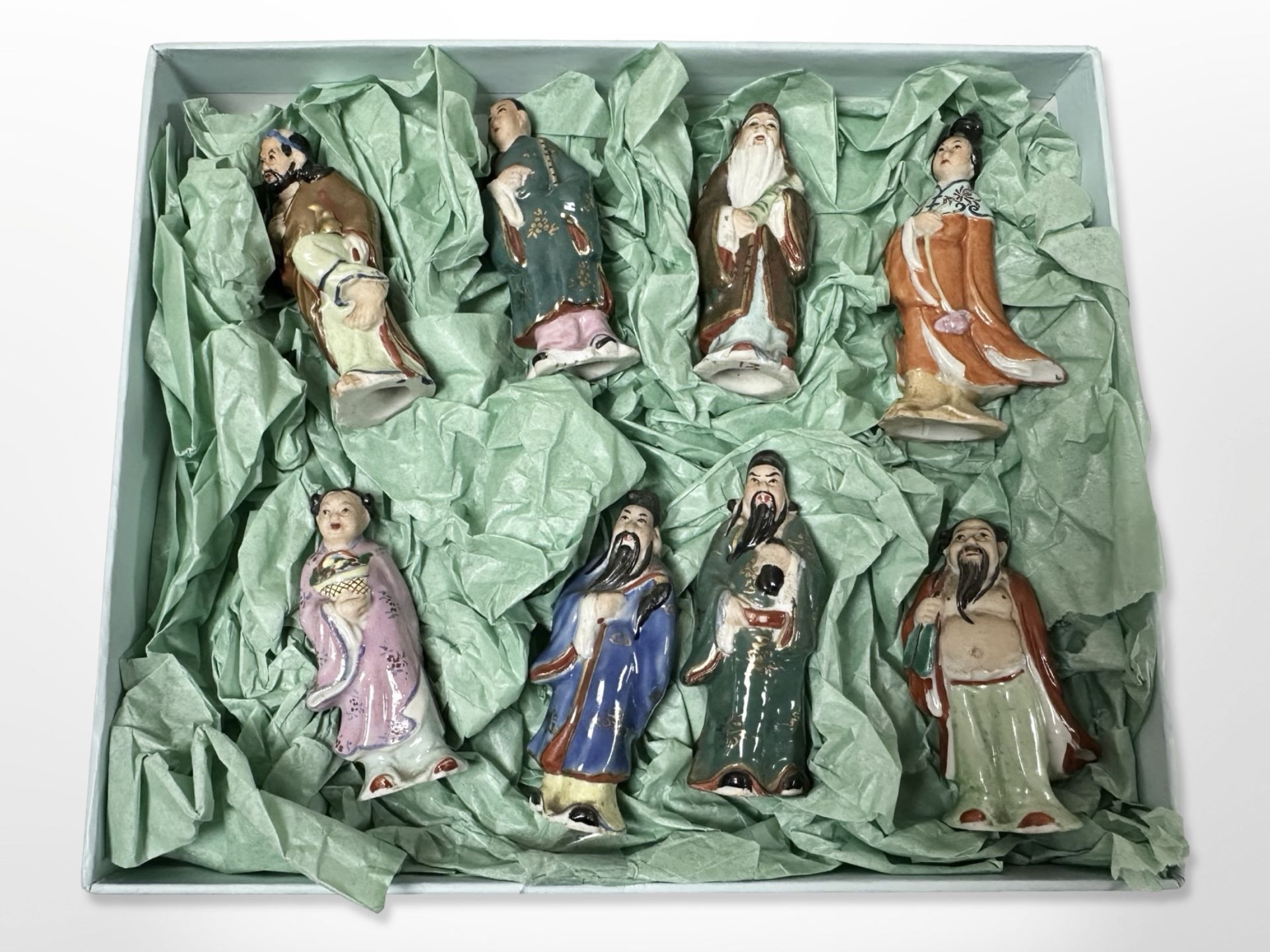 Eight antique Chinese hand painted figures depicting eight Daosim immortals, Lan Cai He,