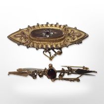 A 19th-century 9ct gold oval memorial brooch, and a further garnet and seed pearl brooch.