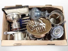 A group of silver-plate, copper and brass wares including teapots, cased cutlery set, toast racks,