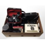 A group of cameras including Pentax ME Zenith Reflex camera, various lenses,