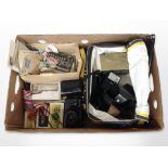 A Zenit ET camera, assorted camera accessories, antique and later postcards, loose stamps, etc.