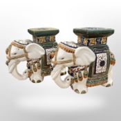 A pair of glazed ceramic elephant plant stands,