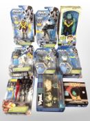A group of nine Mattel, Funko and other figures including Max Steel, Ben 10, etc.