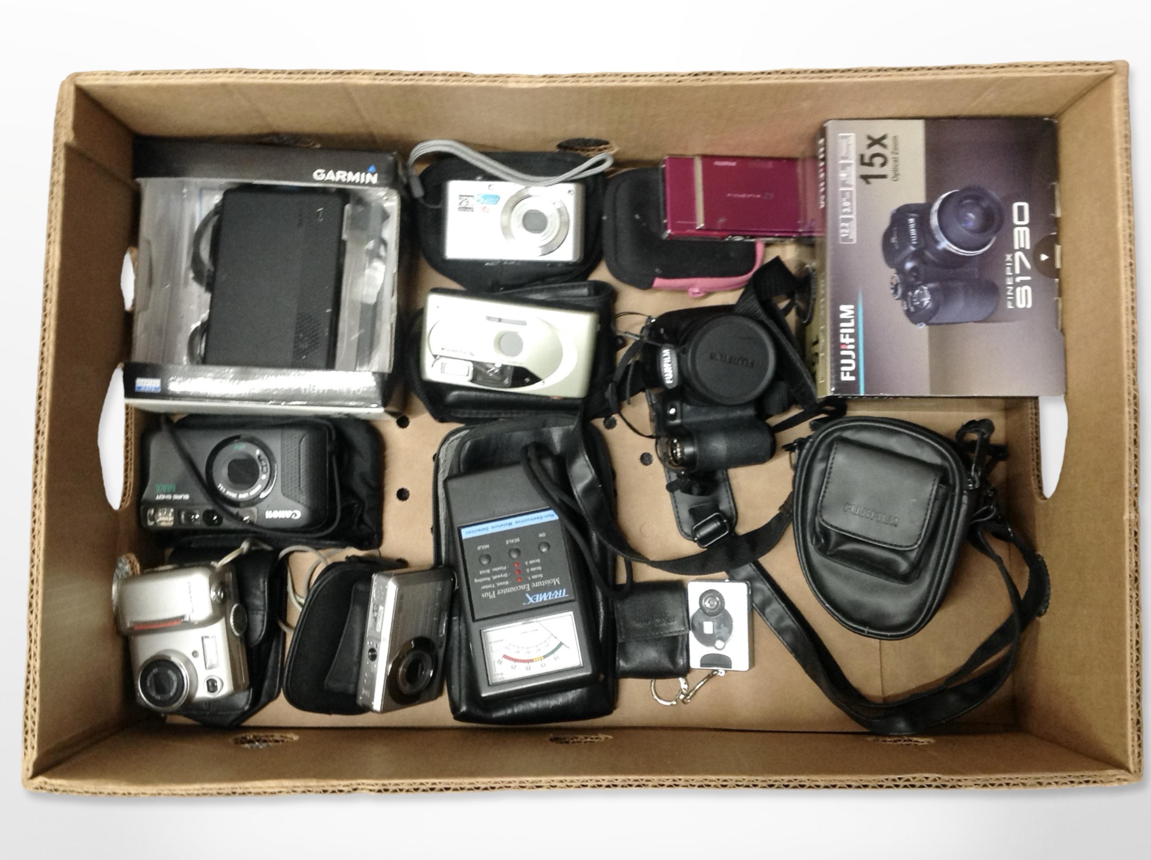 A group of digital cameras including Fujifilm S1730, Canon, Nikon, etc., Garmin Sat-Nav, etc.