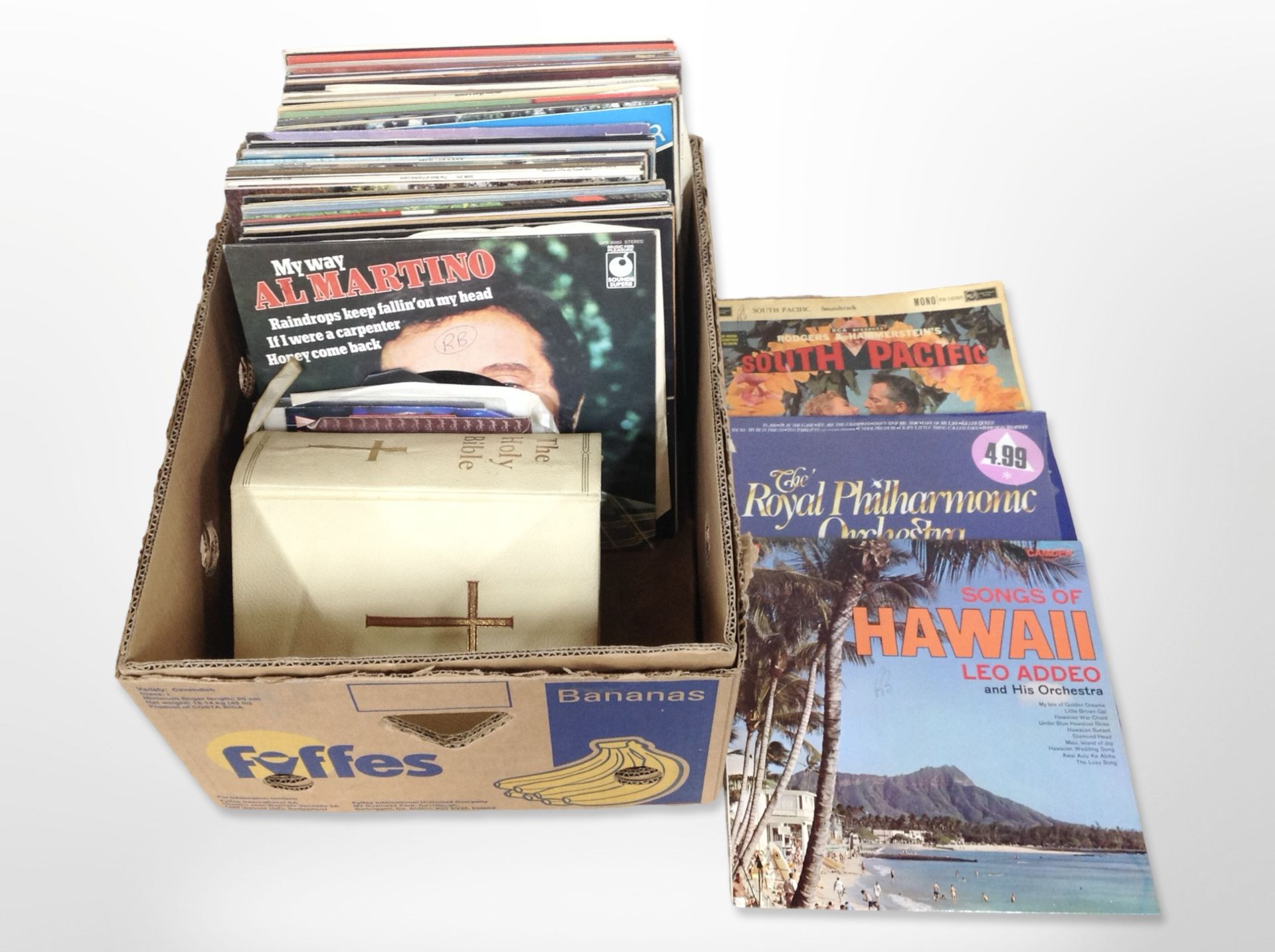 A small group of vinyl LPs and 7-inch singles including compilations, movie themes,