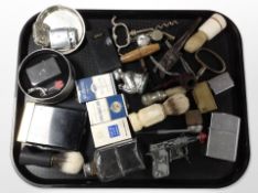 A group of items relating to smoking including lighters, pipes, etc.