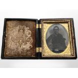 A Victorian daguerreotype miniature, in ornate travel case, 8cm x 6.5cm.