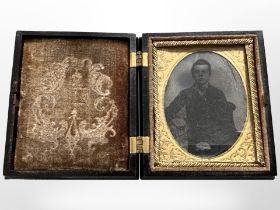 A Victorian daguerreotype miniature, in ornate travel case, 8cm x 6.5cm.