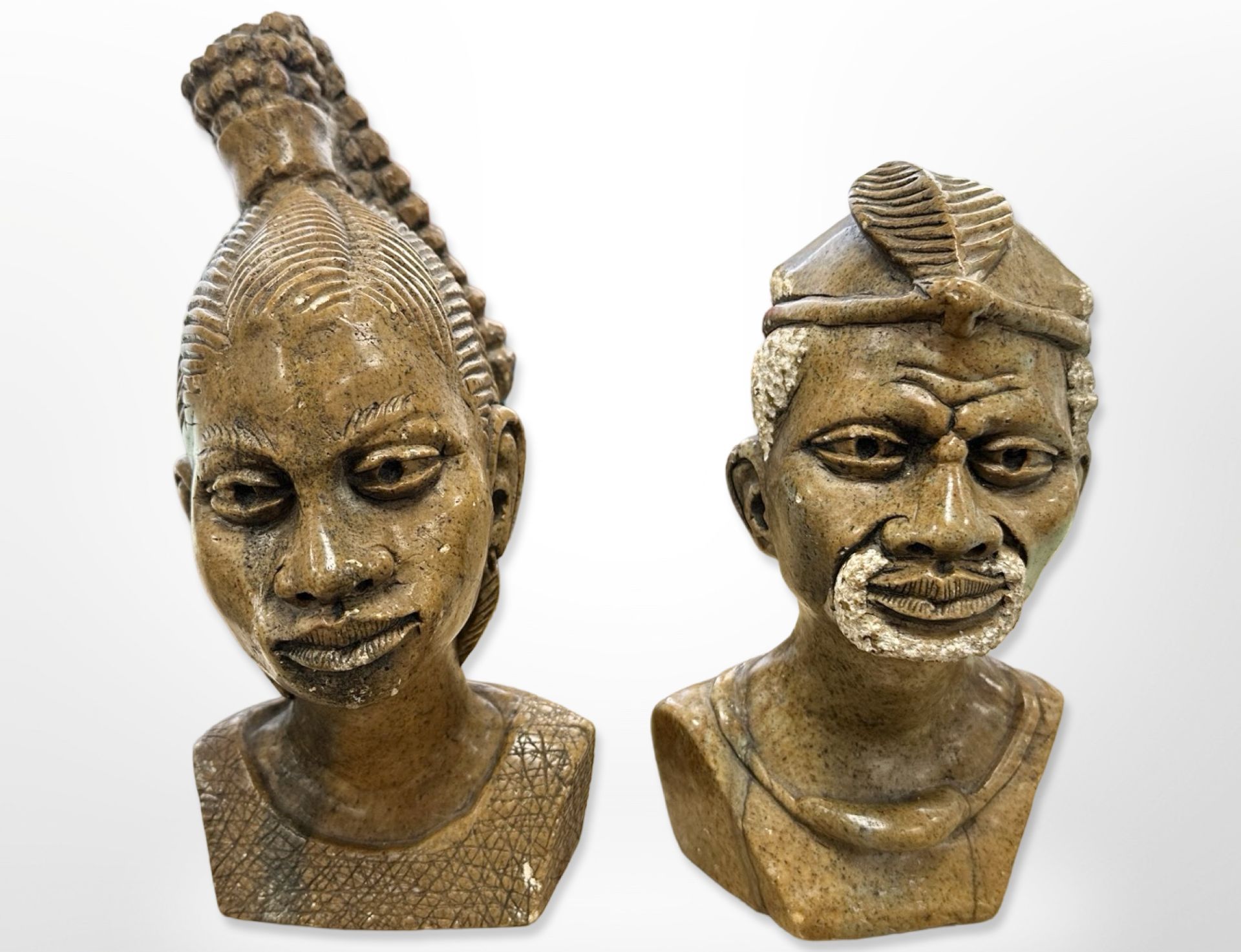 Two African carved stone busts signed Edward Mugumwa,