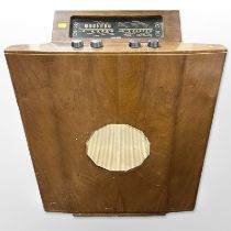 A mid-20th century Murphy walnut-cased radio, width 61cm.