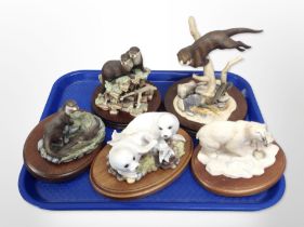 Four Border Fine Arts animal figures, and a further Franklin Mint figure of two seals,