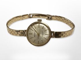 A Lady's 9ct yellow gold Garrard wristwatch CONDITION REPORT: On 9ct gold strap,