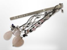 Three rose quartz neecklaces, a Swarovski starfish necklace, and a silver ladies' watch strap.