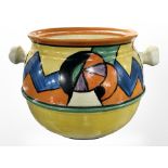A Clarice Cliff for Newport Pottery Bizarre biscuit barrel, height 11.