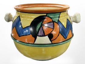 A Clarice Cliff for Newport Pottery Bizarre biscuit barrel, height 11.